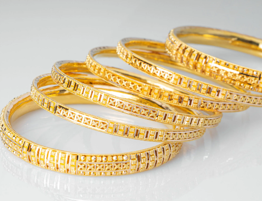 Beautiful and uniquely gold polished stone studded bangle set