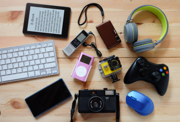 modern Electronic gadgets for daily use on wooden floor