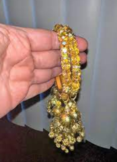 Beautiful and uniquely gold polished jhumki studded bangles