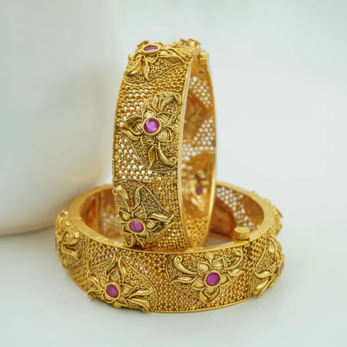 Uniquely rajwadi copper bangles Ruby and emerald studded